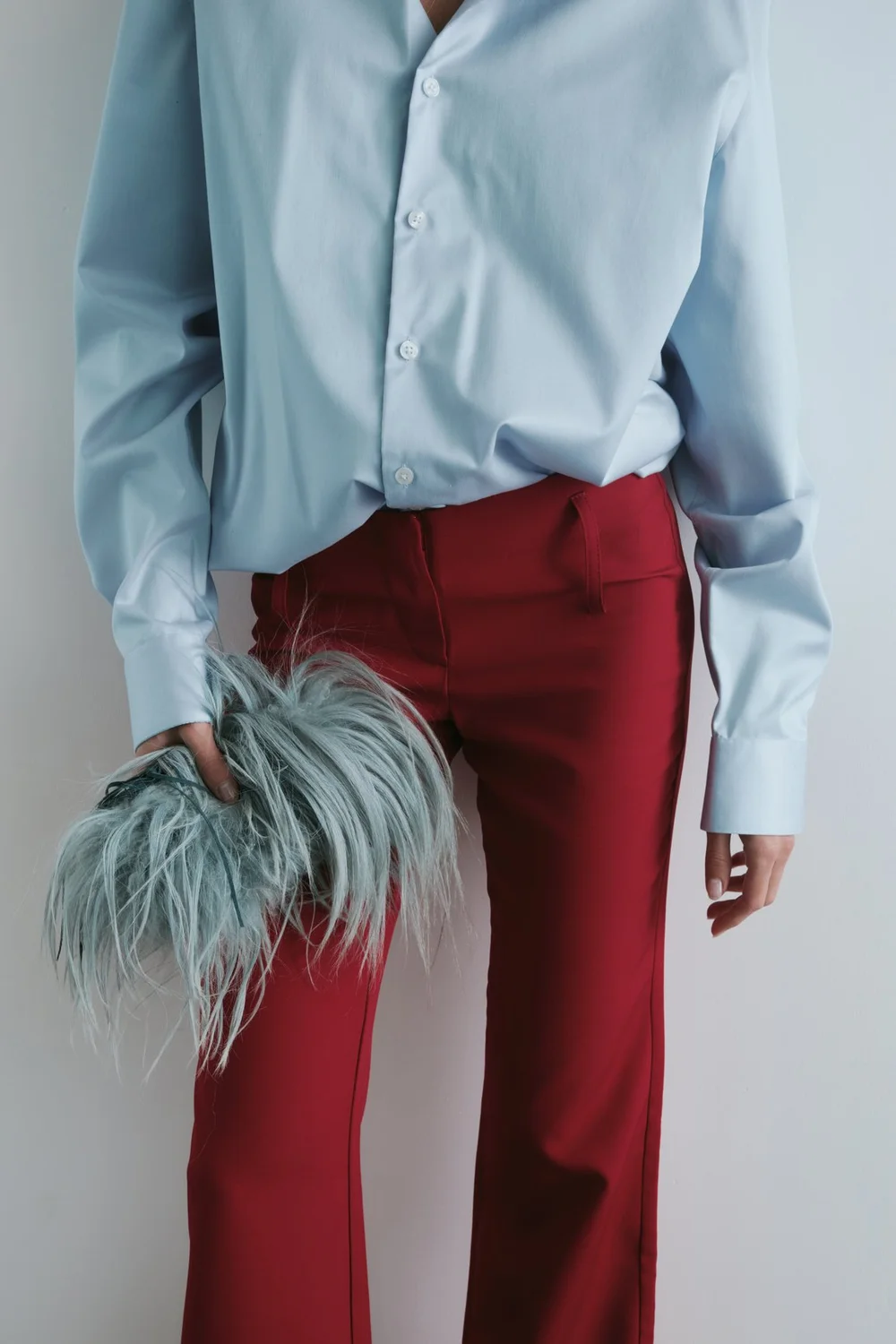 Styled look with a pale blue shirt and red trousers