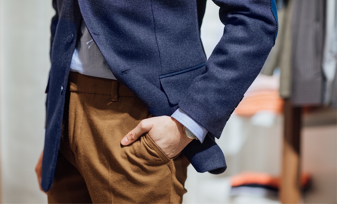 Navy blazer with brown trousers